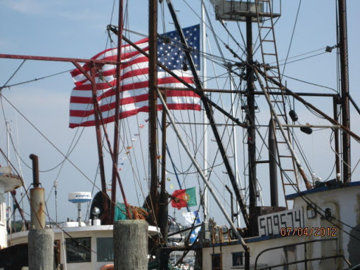 A sailboat named Fial was flying the largest American flag, and a Portuguese flag on the 4th of July, in our little fishing village.