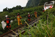 Rescuers work at the site after a train derailed in a tunnel north of Hualien, Taiwan, on April 2 2021. 