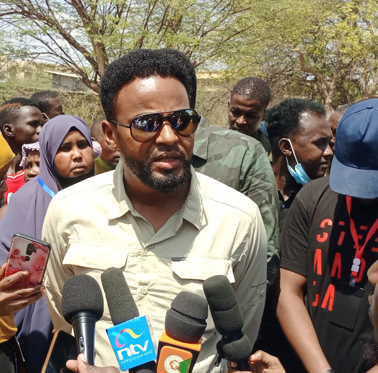 Garissa Senator Abdul Haji speaking to the press at the Garissa Primary polling station on Tuesday, August 9.