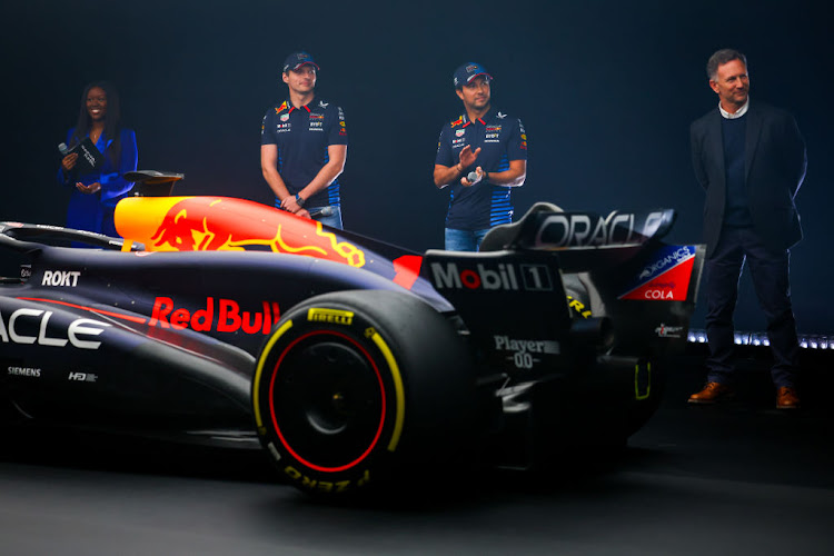 Max Verstappen, left, Sergio Perez, middle, and Red Bull Racing Team principal Christian Horner with the RB20 during the Oracle Red Bull Racing RB20 car launch at Red Bull Racing Factory on February 15 2024 in Milton Keynes, England. Picture: MARK THOMPSON/GETTY IMAGES FOR RED BULL RACING.