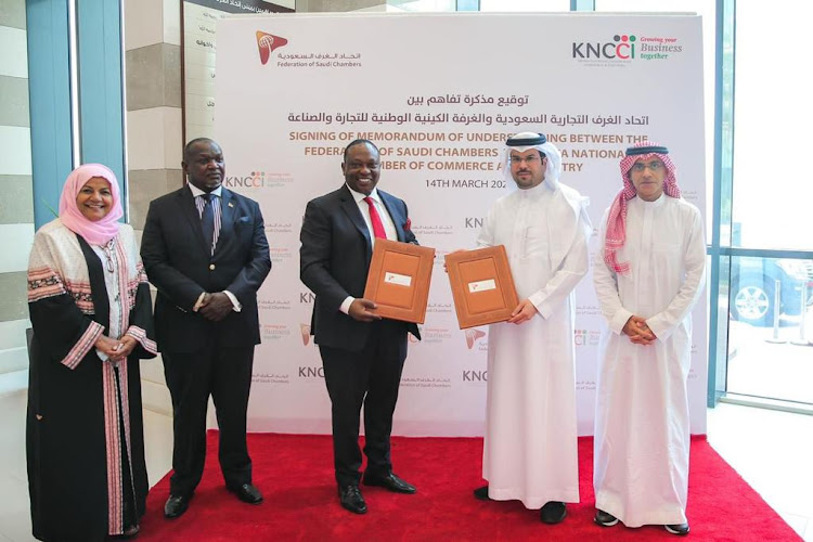 Kenya National Chamber of Commerce and Industry president Richard Ngatia and Secretary General of the Federations Council of Saudi Chambers Hussain Alabdulkader , with officials from the two countries, during the Saudi Arabia – Kenya Business Forum at the Council of Saudi Chambers/KNCCI