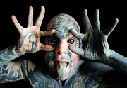 Sylvain, alias Freaky Hoody, a primary school teacher and France’s ‘most tattooed man’, poses in Paris. 