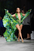 Jennifer Lopez models an updated version of her iconic jungle-print gown during the Versace Spring/Summer 2020 show at Milan Fashion Week.