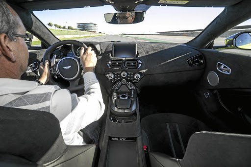 The interior shows a few Mercedes-AMG bits but it all has that Aston touch of style