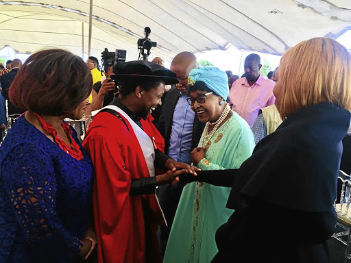 Dr Mbuyiseni Ndlozi welcomes Winnie Madikizela-Mandela and her entourage to his graduation party in Orange Farm on Sunday. EFF leader Julius Malema is standing between them. / supplied