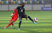 Deon Hotto of Orlando Pirates is challenged by Ahmed Al Haram of Al Ittihad during the CAF Confederation Cup 2021/22 game between Al Ittihad and Orlando Pirates at Martyrs of February Stadium in Benghazi, Libya.