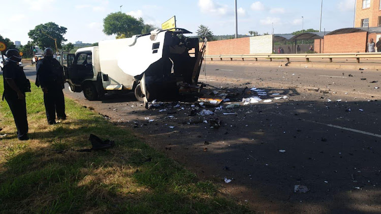 The cash van was damaged by an explosion after being rammed.