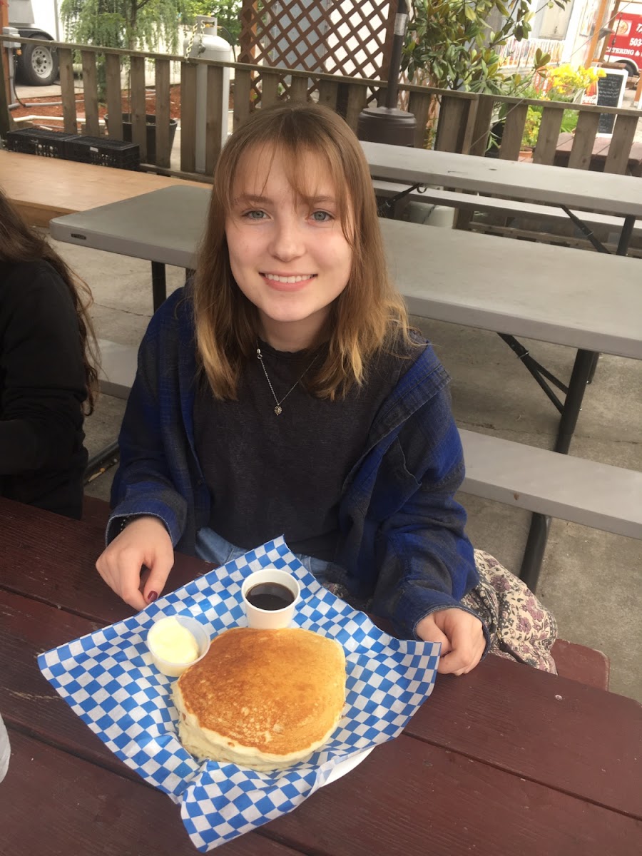 Pancakes served with hot syrup. Yum!