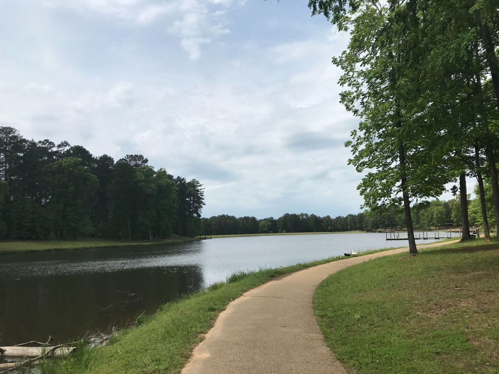 A photo of a trail long water, representing the author's favorte park for taking a walk