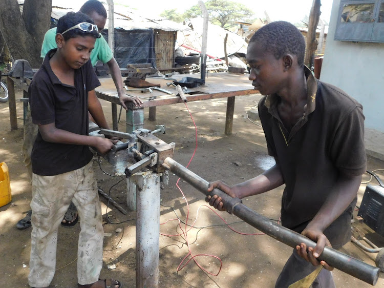 Jua kali artisans at work at the Malindi Constituency Industrial Development Centre in Malindi town on August 31, 2020.