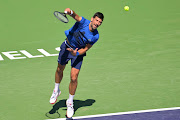 Novak Djokovic (SRB) practises on court during the BNP Paribas Open at the Indian Wells Tennis Garden. 