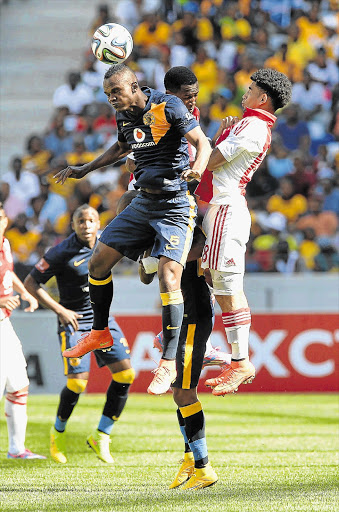 SOME SHUTEYE: Siboniso Gaxa of Kaizer Chiefs leaps to win the ball from Keagan Dolly in yesterday's clash. Chiefs won 1-0