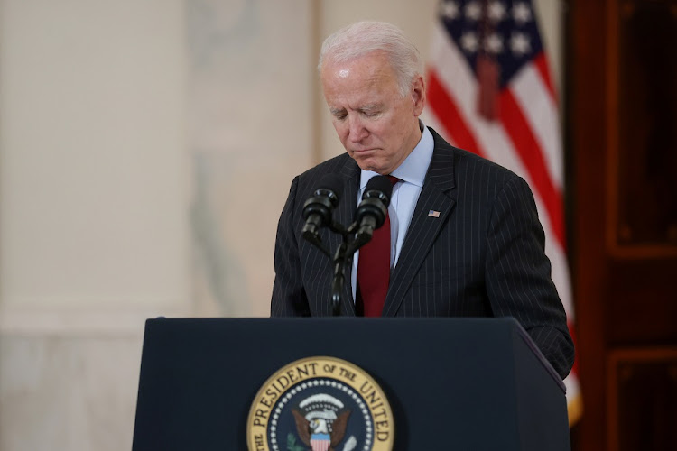 US President Joe Biden concludes his remarks in honor of the 500,000 US deaths from Covid-19, in the Cross Hall at the White House in Washington, US, on February 22 2021.