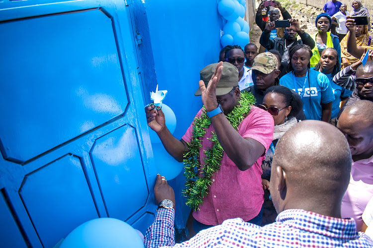 Shofco CEO Kennedy Odede launching a new pharmacy in Mukuru Kwa Njenga slums.