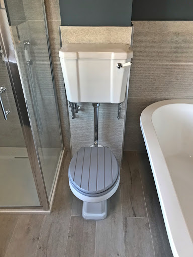 traditional style toilet with chrome brackets 