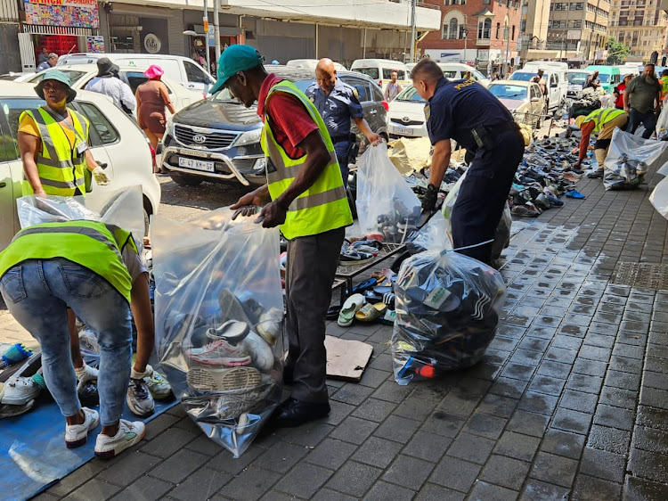 Law enforcement seizes counterfeit goods in the Joburg CBD.