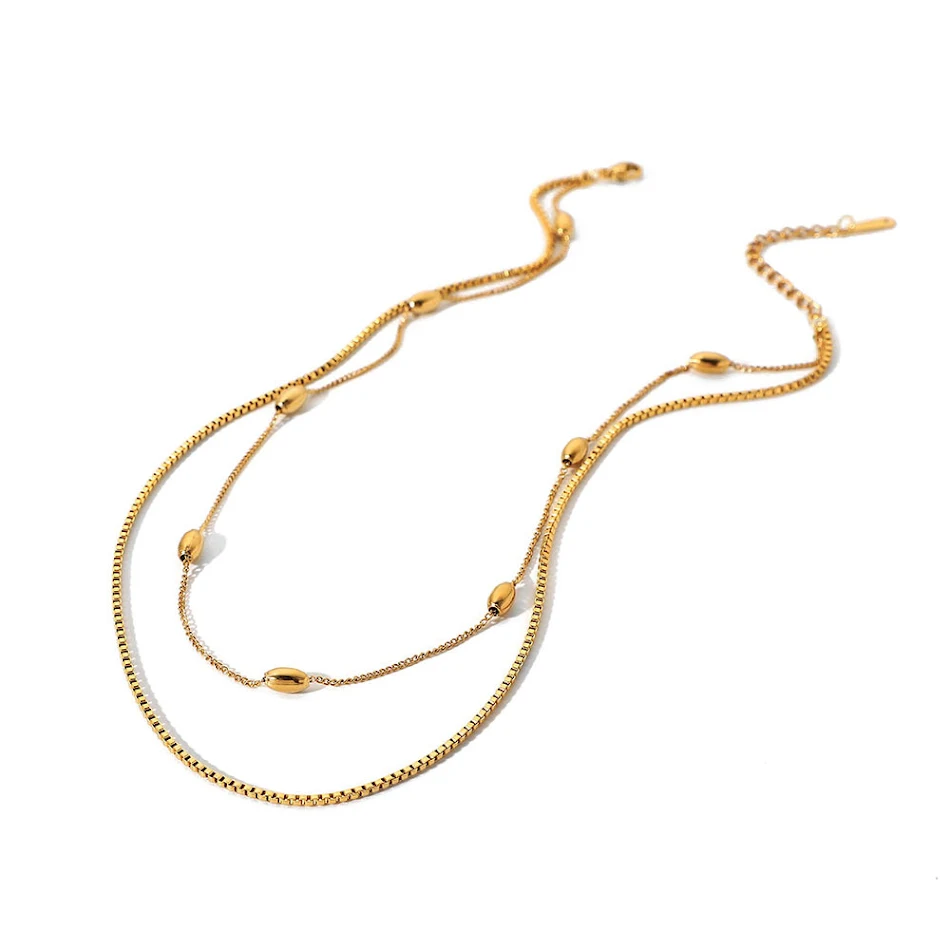 Gouden dubbellaagse ovale kralen ketting voor dames. Modieuze sieraden voor vrouwen. Een elegante accessoire voor elke gelegenheid.