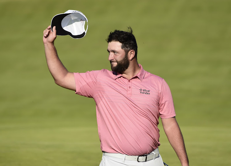 Spain's Jon Rahm acknowledges the crowd on the 18th green after completing his final round