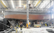 RATED ARRRRRR: A huge tugboat under construction waits to be finished in Damen Shipyards in Cape Town. The Mother City is fast becoming a recognised ship-building and repair hub for global shipping, due to its long history as a vital sea port