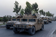 A convoy of Afghan Special Forces is seen during the rescue mission of a policeman besieged at a check post surrounded by Taliban, in Kandahar province, Afghanistan, July 13, 2021.  