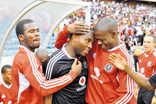 Benni McCarthy celebrates with Pirates teammates after his winning goal against Maritzburg United at Orlando stadium on Sunday Picture: DUIF DU TOIT/GALLO IMAGES