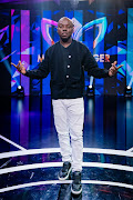 Radio broadcaster Tbo Touch joins the Masked Singer detectives a guest judge.