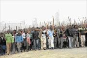 THE STRUGGLE CONTINUES: Disgruntled mineworkers at Marikana in North West again took to the streets yesterday instead of joining negotiations to end the strike.  PHOTOS: ANTONIO MUCHAVE