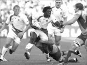 ENTANGLED: England's Paul Sackey is tacckled during his quarterfinal Rugby World Cup match against Australia in Marseille on Saturday. Pic. Regis Duvignau.  06/10/2007. © Reuters