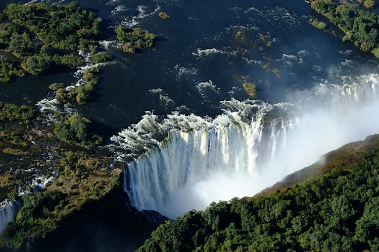 Victoria Falls isn’t the world’s highest or widest waterfall, but is classified the largest sheet of falling water, thanks to its combined width of 1,708m and height of 108m.