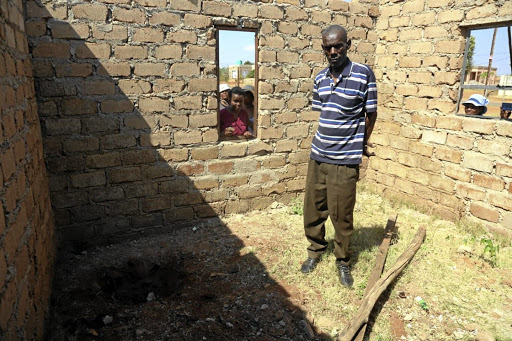 Landlord Reginald Leshapa in front of the shallow grave where Katlego Mokwana's body was found.