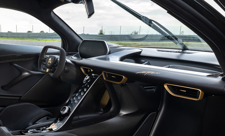 The special-edition Evija Fittipaldi has Lotus’s iconic black and gold colour scheme, with the Formula One driver's signature on the dashboard.