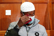 Liban Abdullah Omar reacts after he was acquitted at the Milimani Law Courts in Nairobi, Kenya October 7, 2020. Omar was reportedly abducted by gunmen moments after he was acquitted in one of the country's most high-profile terrorism cases.