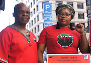 Caption: Nehawu members Siyanda Ngudle and Lungiswa Nante picket in Cape Town on Wednesday. 