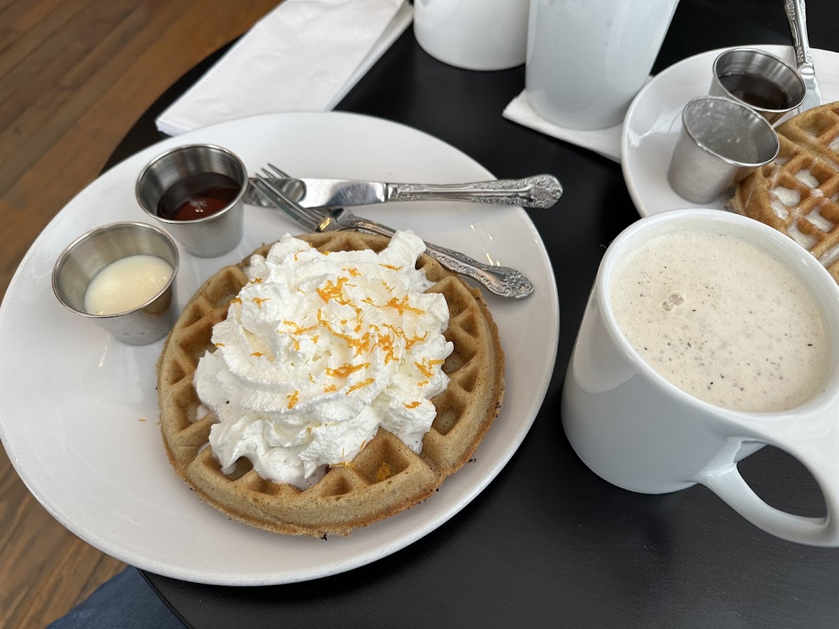 Seasonal cinnamon waffle with whipped cream and orange zest with an Earl Grey latte