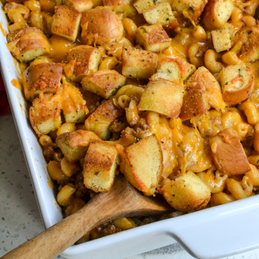 A fun and easy Cheeseburger Casserole with ground beef, onion, garlic and pasta in a cheesy sauce topped with more cheese and fresh homemade bun croutons. 