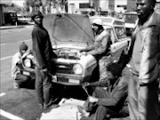 ROADSIDE MECHANICS: Motor mechanics like these will now be slapped with a fine of no less than R300 if found conducting their business on the streets of Polokwane. © Unknown.