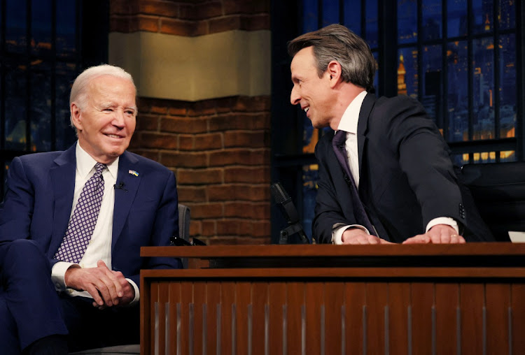 US President Joe Biden laughs during a break in a taped TV interview on NBC's "Late Night With Seth Meyers" in New York City, US, February 26, 2024.