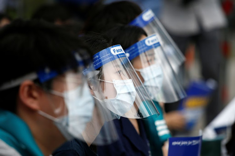 Medical residents and doctors attend a 24-hour strike amid the Covid-19 pandemic to protest a government plan to increase medical school admissions by 400 a year for the next decade to prepare for potential infectious disease outbreaks, in Seoul, South Korea, on August 14 2020.