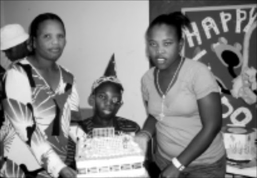 NOT FORGOTTEN: Lindokuhle Ntshaba, 17, who suffers from an incurable sickness, celebrates his birthday at the Charlotte Maxeke Academic Hospital in Johannesburg with his schoolmates and mother. 12/11/08. Photo: Tebogo Monama. © Sowetan.