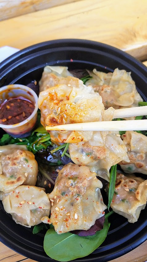 Dumpling Week 2018 - For dumpling week Mama Chow Kitchen offered a pan seared version of their wontons from their standard wonton soup, these are Pork and Shimp dumplings on a bed of baby green salad and served with a spicy dipping sauce.