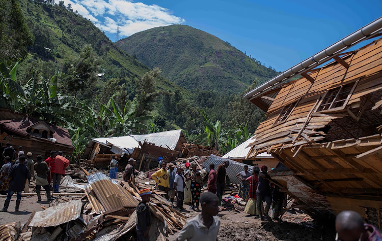 Congolese civilians view destroyed homes after flash floods in Nyamukubi village, Kalehe territory in South Kivu province of the Democratic Republic of Congo, May 6 2023.