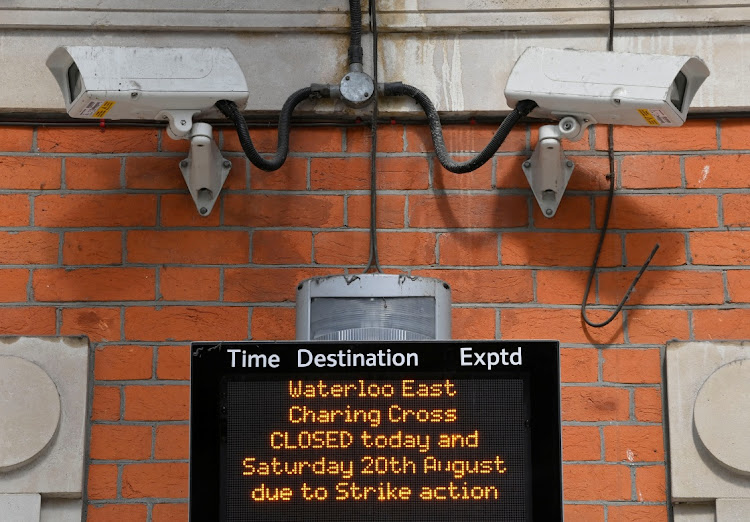 A passenger information message is displayed, as rail workers in Britain strike over pay and terms, at Waterloo Station in London, Britain, on August 18 2022. Picture: REUTERS/TOBY MELVILLE