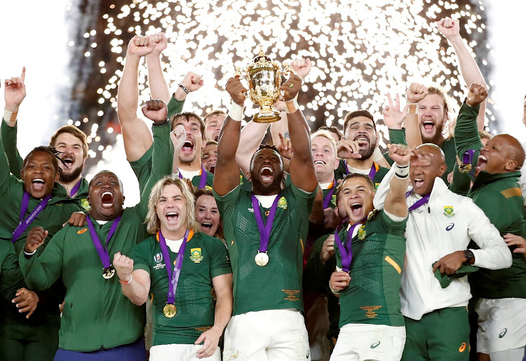 South Africa's Siya Kolisi celebrates with the Webb Ellis trophy after winning the 2019 Rugby Union World Cup final in Yokohama, Japan