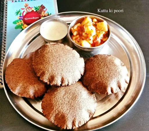 Aloo Sabzi + Kuttu Ke Atte Ki Poori (4Pcs) + Raita (Tomato & Cucumber)