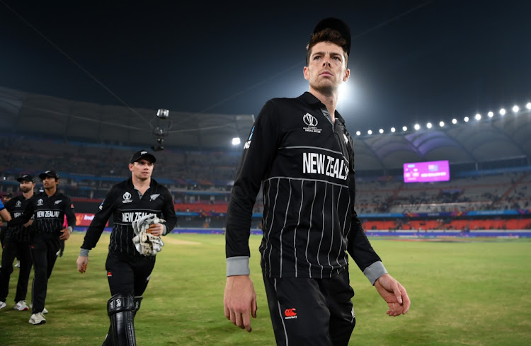 Mitchell Santner leads New Zealand off after taking five wickets in the ICC Cricket World Cup India match against Netherlands at Rajiv Gandhi International Stadium in Hyderabad, India on Monday.