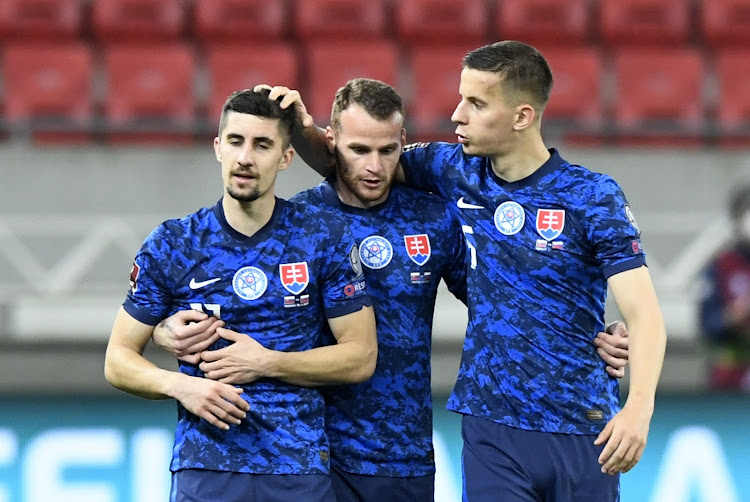 Slovakia's Lubomir Satka celebrates with teammates after the match REUTERS/Radovan Stoklasa