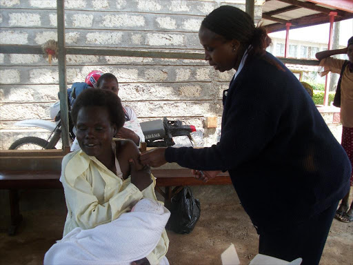 A file photo of a patient seeking vaccinations services at a public health facility. /FILE