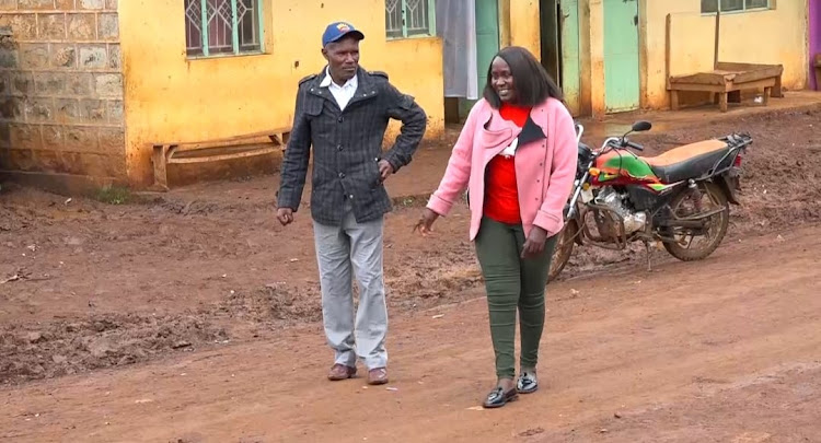 Karumandi MCA-elect Caroline Wanjiku Muriithi with a resident.