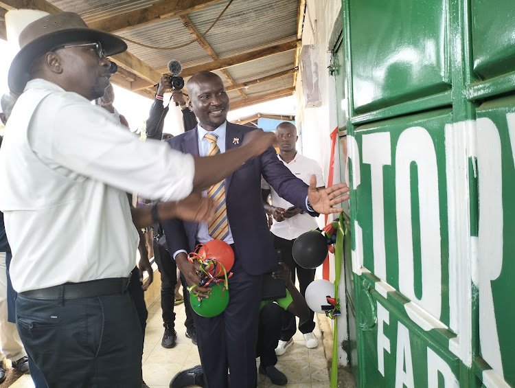 Victory Farms chief development officer and Siaya executive for Agriculture and fisheries Sylvester K'Okoth open ne depot for fish in Bondo town on April 25,2023