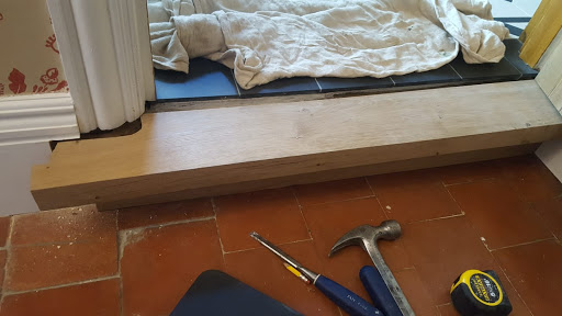 Bespoke oak threshold being installed 